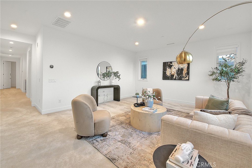 20164 Galway Lane Porter Ranch, CA 91326 - Photo 34 of 74 a living room with furniture and a potted plant