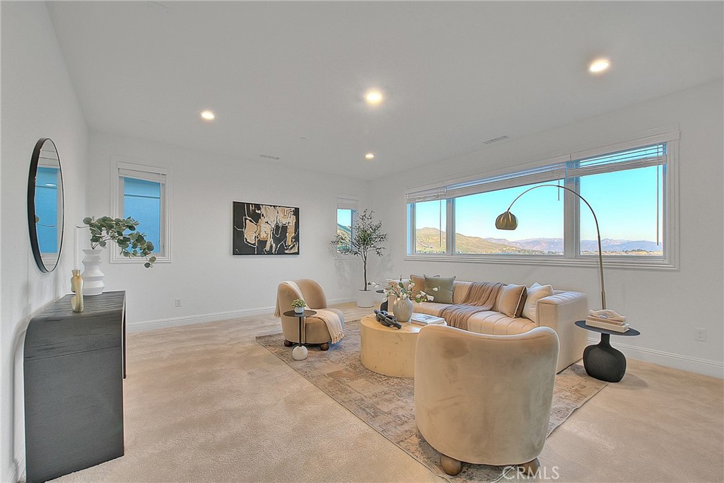 20164 Galway Lane Porter Ranch, CA 91326 - Photo 36 of 74 a living room with furniture and a large window
