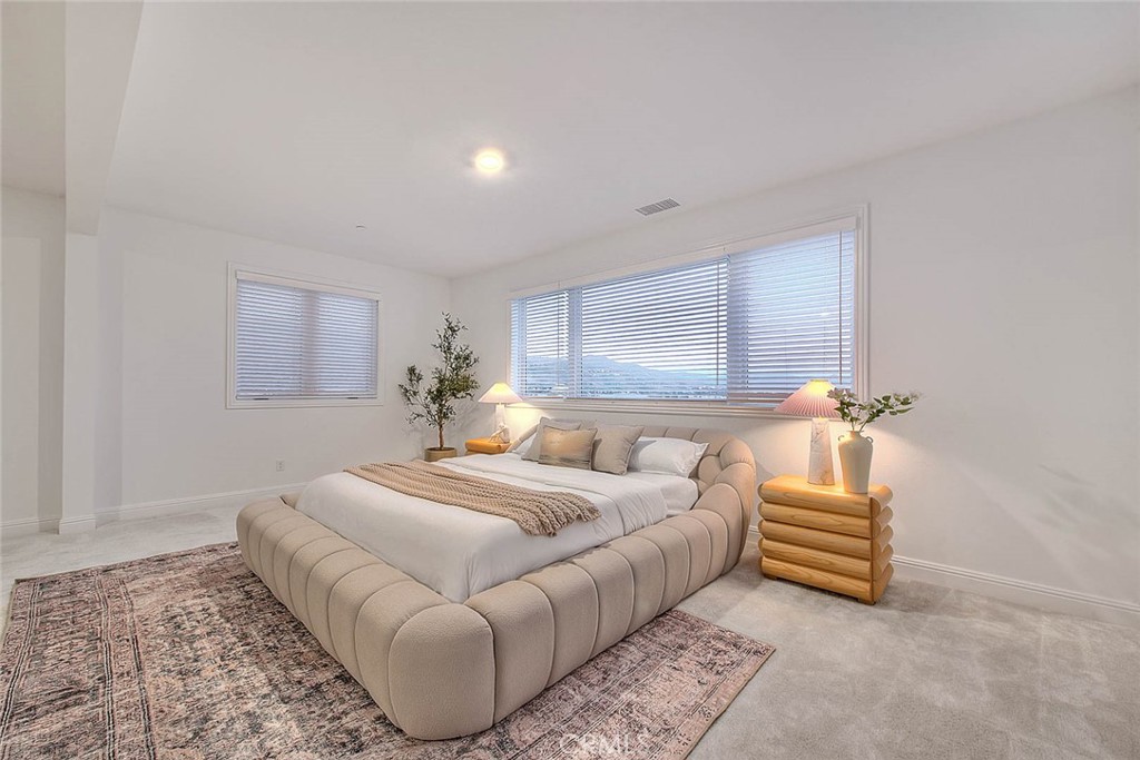 20164 Galway Lane Porter Ranch, CA 91326 - Photo 37 of 74 a bedroom with a bed and a window
