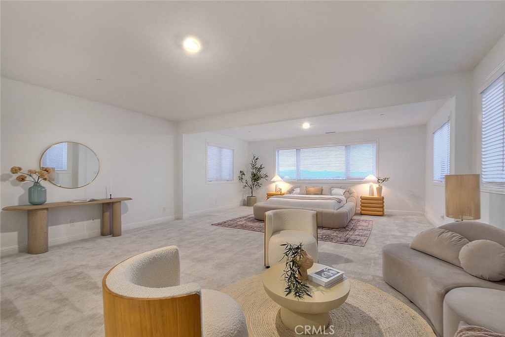 20164 Galway Lane Porter Ranch, CA 91326 - Photo 40 of 74 a living room with kitchen island furniture and a wooden floor