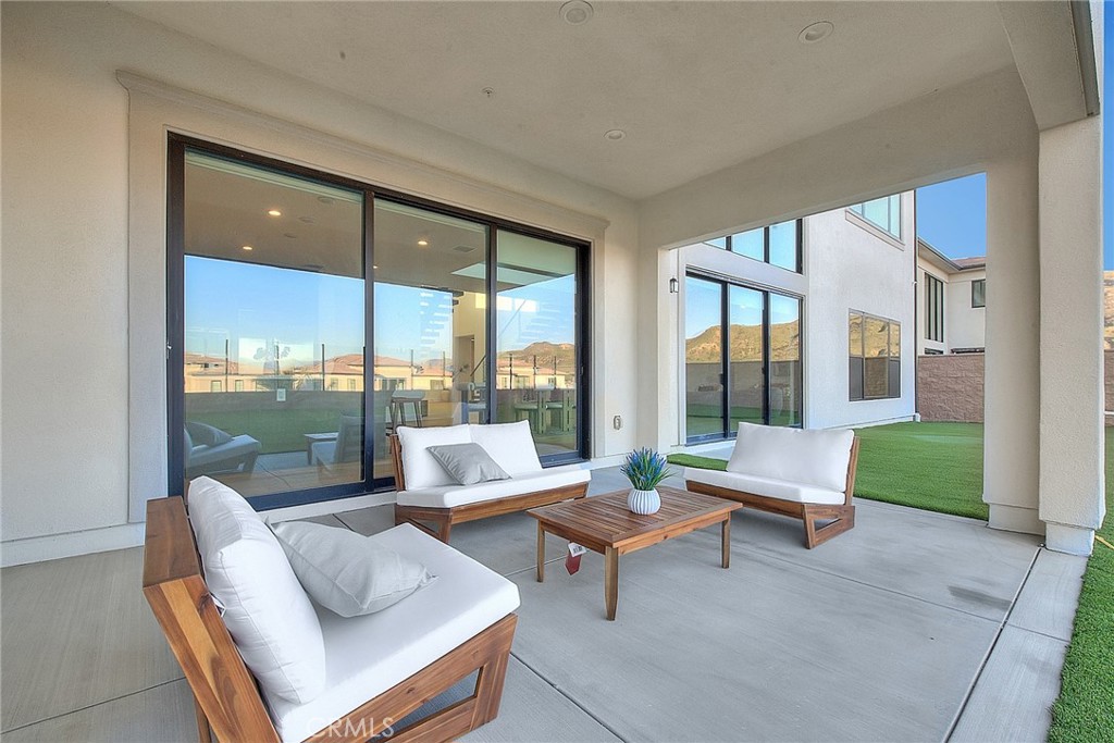 20164 Galway Lane Porter Ranch, CA 91326 - Photo 46 of 74 a living room with furniture and a large window