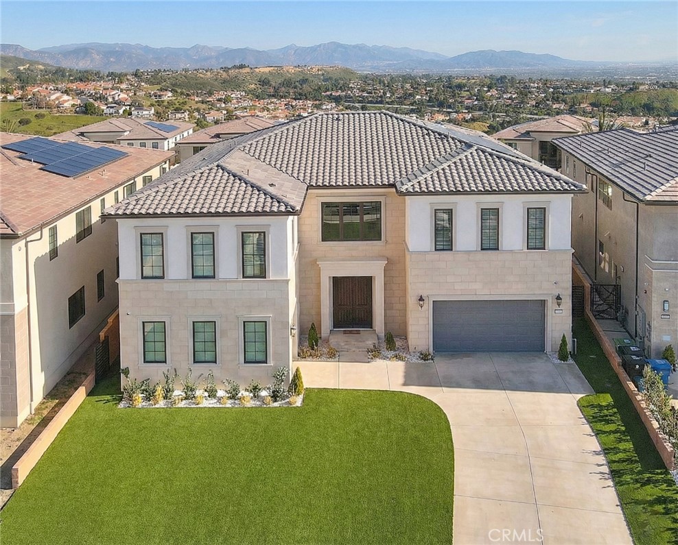 20164 Galway Lane Porter Ranch, CA 91326 - Photo 60 of 74 a front view of a house with a yard