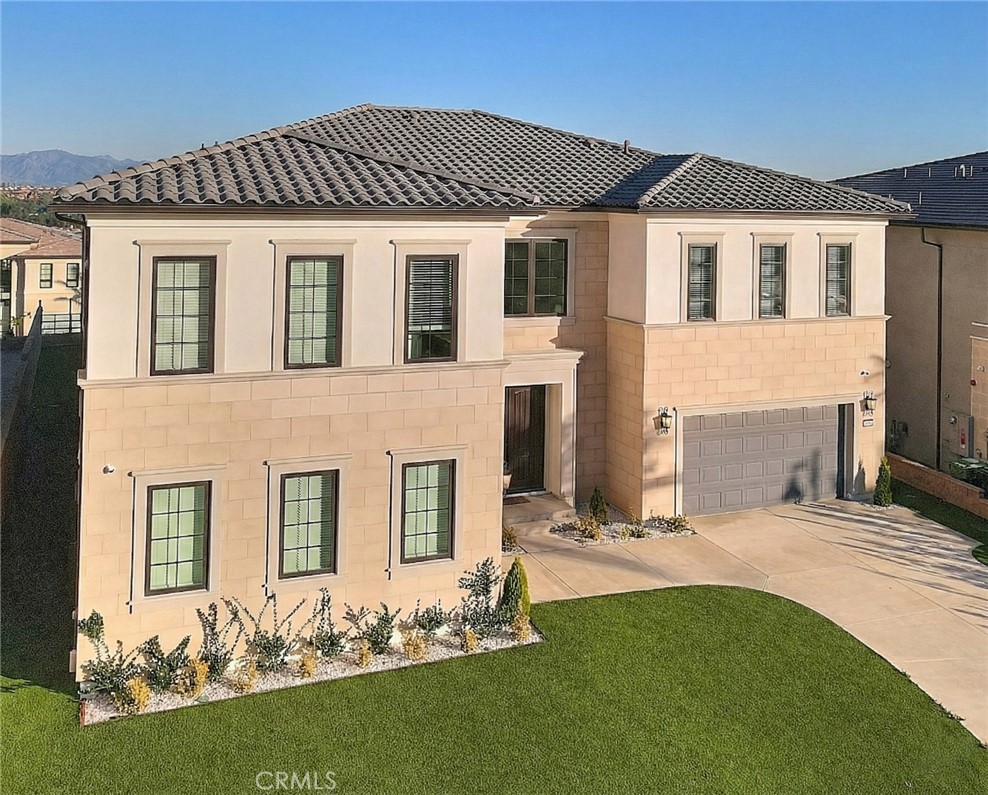 20164 Galway Lane Porter Ranch, CA 91326 - Photo 61 of 74 a front view of a house with a yard