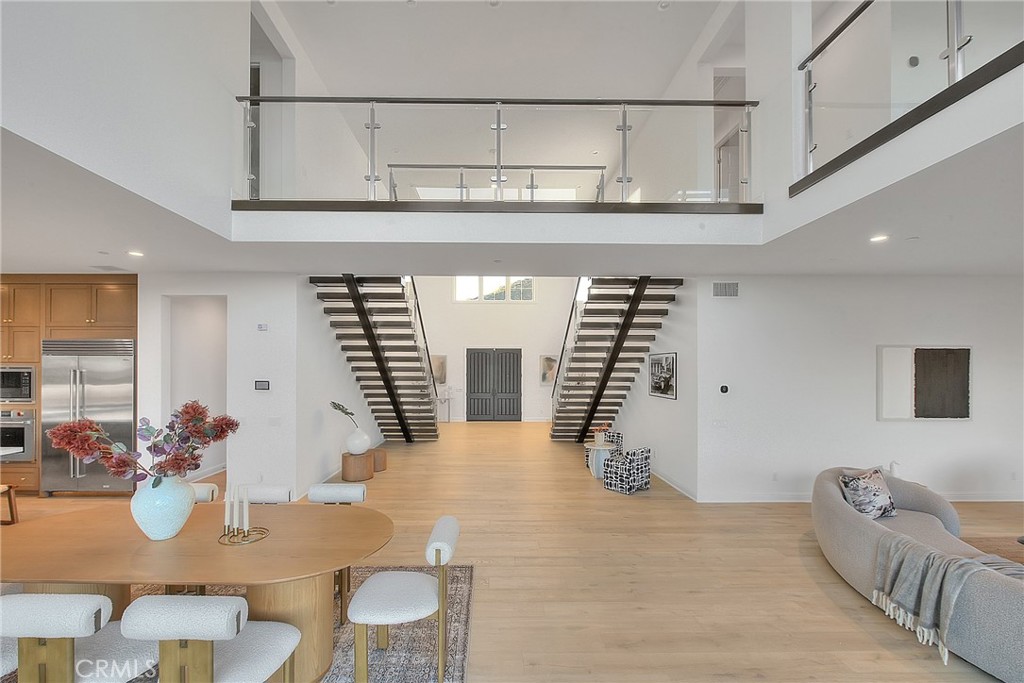 20164 Galway Lane Porter Ranch, CA 91326 - Photo 7 of 74 a hallway with furniture and wooden floor
