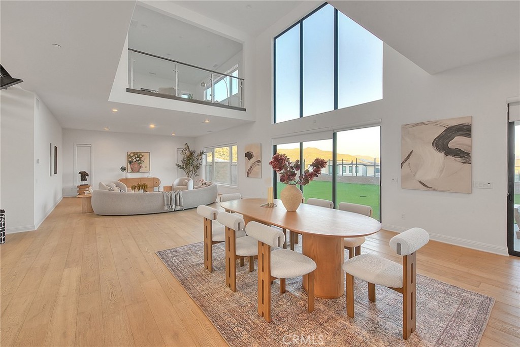 20164 Galway Lane Porter Ranch, CA 91326 - Photo 8 of 74 a living room with furniture and a floor to ceiling window