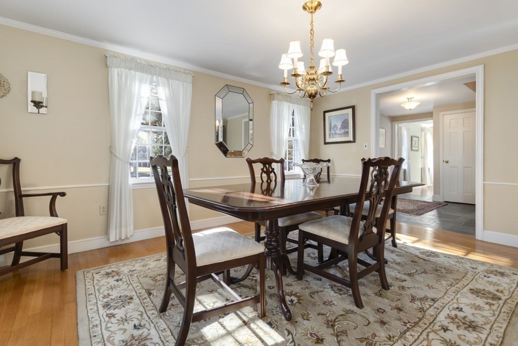8 Townsend Road Lynnfield, MA 01940 - Photo 12 of 41 a view of a dining room with furniture and chandelier