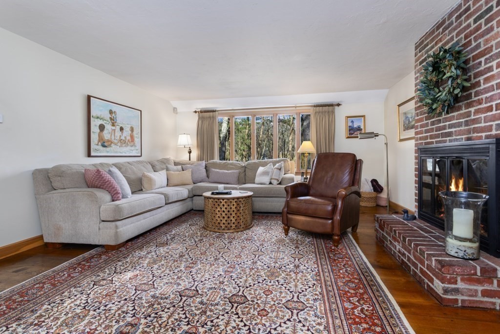 8 Townsend Road Lynnfield, MA 01940 - Photo 21 of 41 a living room with furniture and a fireplace