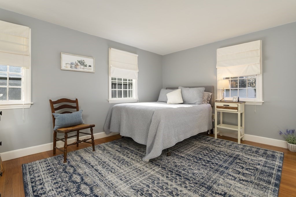 8 Townsend Road Lynnfield, MA 01940 - Photo 22 of 41 a bedroom with a bed and wooden floor