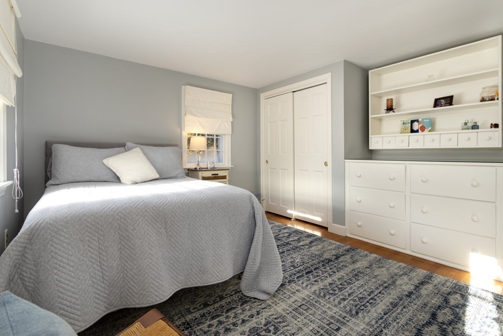 8 Townsend Road Lynnfield, MA 01940 - Photo 23 of 41 a bedroom with a bed and painting on the wall