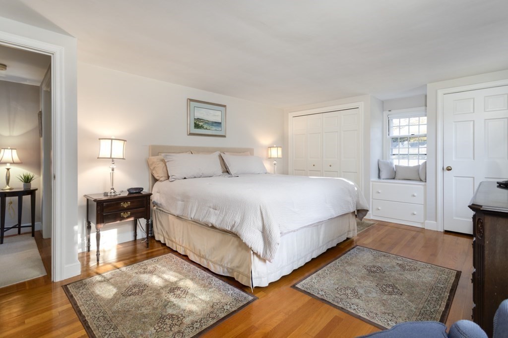 8 Townsend Road Lynnfield, MA 01940 - Photo 27 of 41 a bedroom with a bed and wooden floor