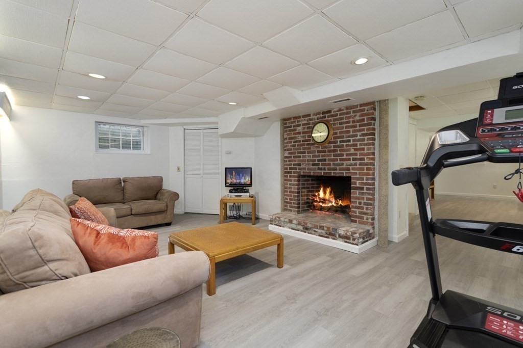8 Townsend Road Lynnfield, MA 01940 - Photo 31 of 41 a living room with furniture and a fireplace
