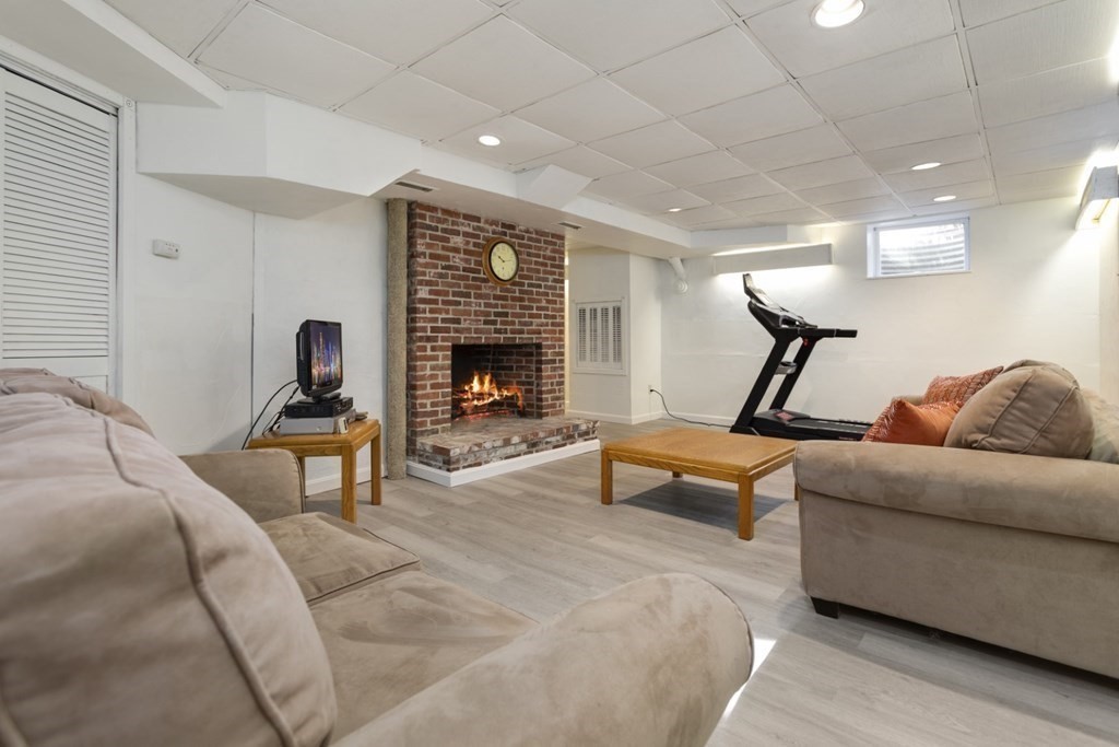 8 Townsend Road Lynnfield, MA 01940 - Photo 32 of 41 a living room with furniture and a fireplace
