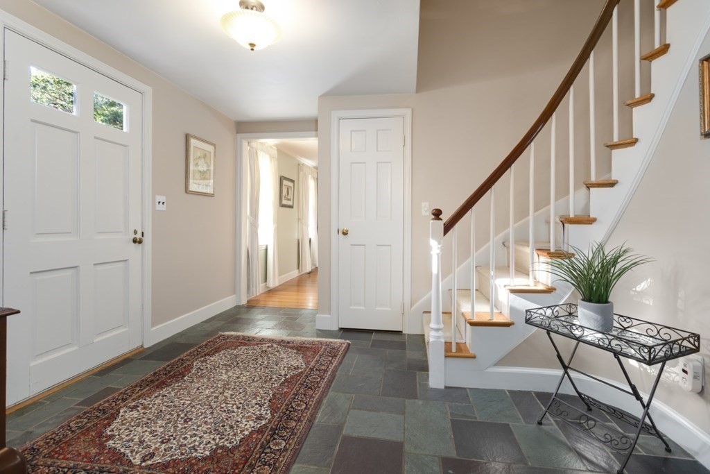 8 Townsend Road Lynnfield, MA 01940 - Photo 4 of 41 a view of entryway with wooden floor and a rug