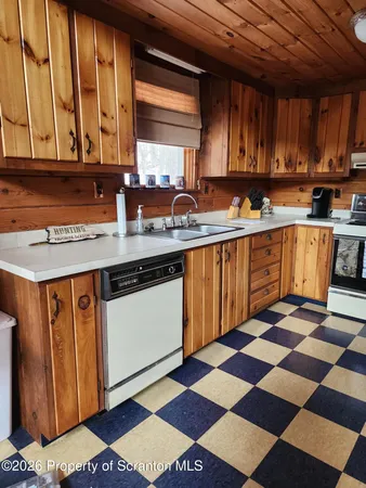 a kitchen with stainless steel appliances granite countertop a sink and cabinets