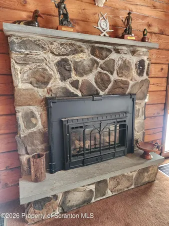 a black and white photo of a fireplace