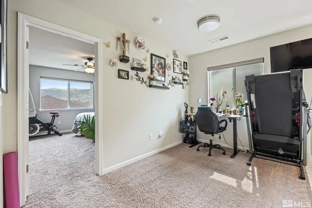 a workspace with furniture and a gate