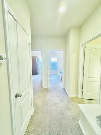 a bedroom with a bed and a chair