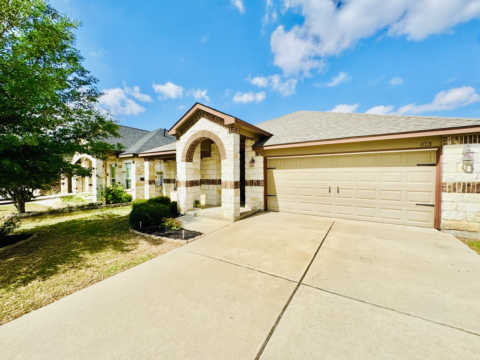 413 Gettysburg Loop Elgin, TX 78621 - Photo 2 of 32 a front view of a house with a yard
