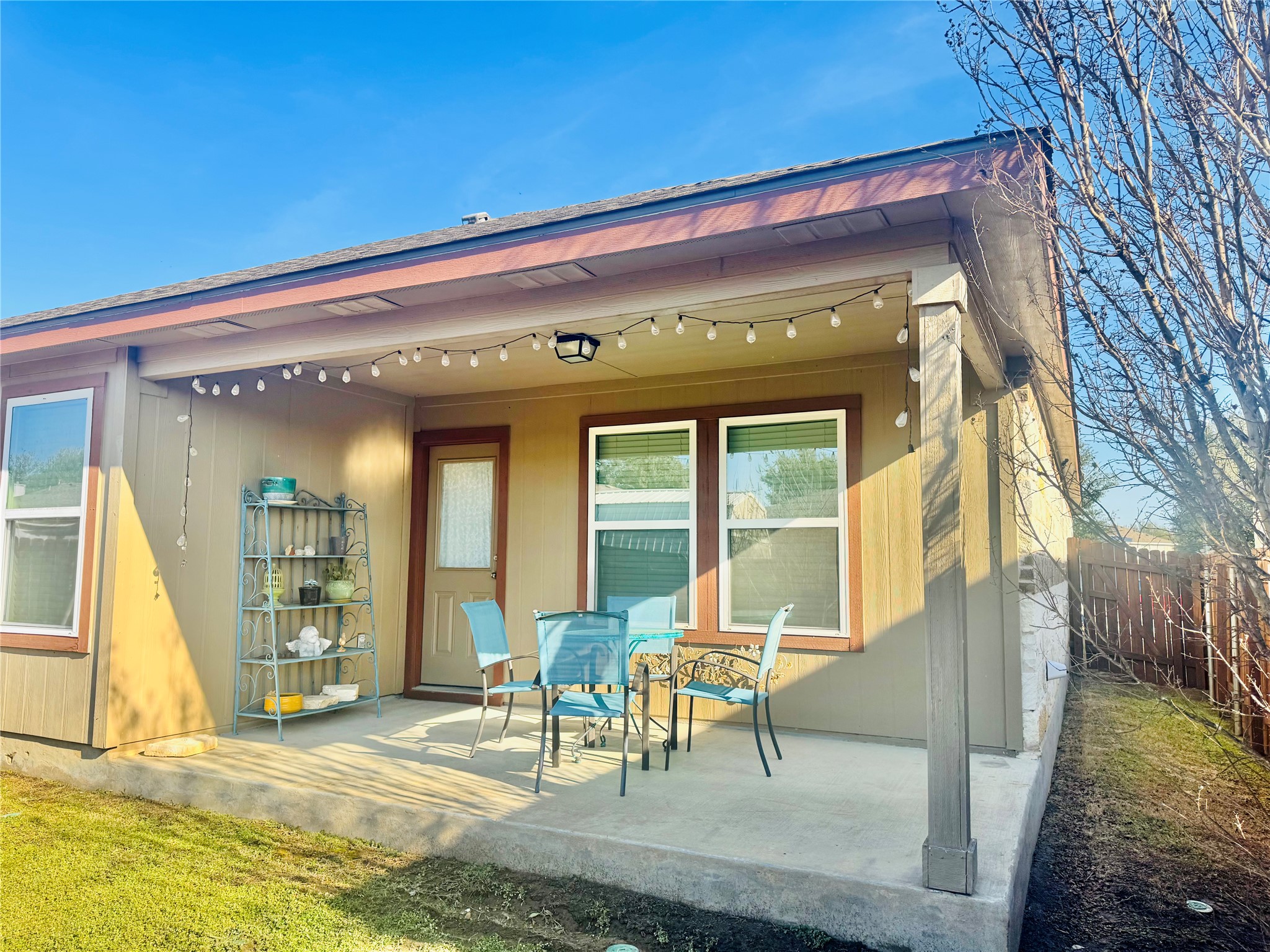 413 Gettysburg Loop Elgin, TX 78621 - Photo 31 of 32 a view of a building with chair and table