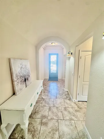 a spacious bathroom with a mirror and a shower