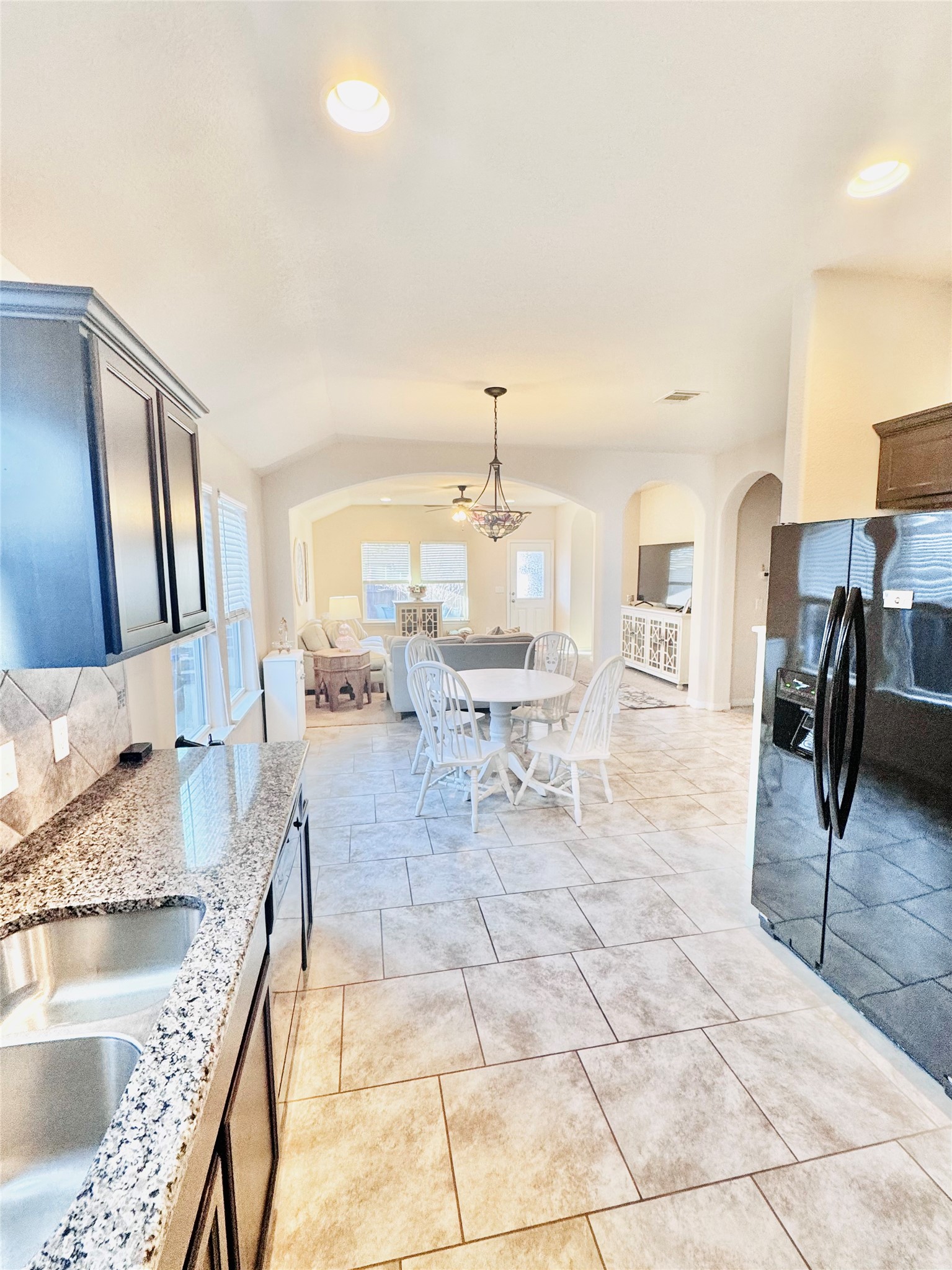 413 Gettysburg Loop Elgin, TX 78621 - Photo 10 of 32 a living room with furniture and a chandelier