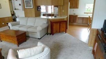 41 Pipers Way Carver, MA 02330 - Photo 6 of 36 a living room with couches and furniture with kitchen view