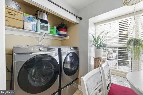 a utility room with dryer and washer