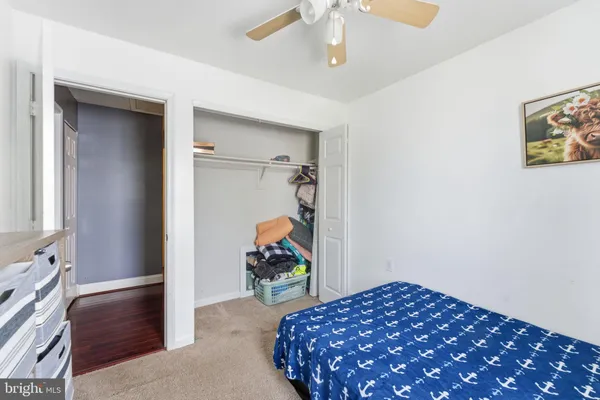 a bedroom with a bed and a view of bedroom