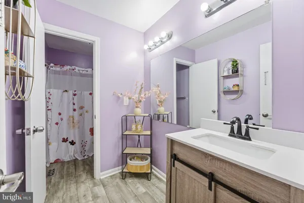 a bathroom with a sink a vanity and a mirror