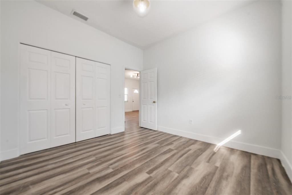 8304 North 13th Street Tampa, FL 33604 - Photo 14 of 22 wooden floor in an empty room