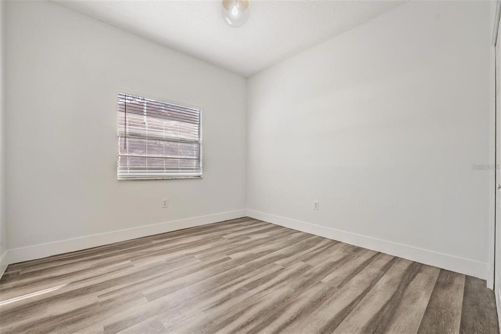 8304 North 13th Street Tampa, FL 33604 - Photo 15 of 22 an empty room with a window