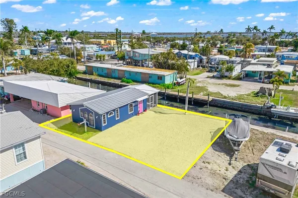 a view of a city from a balcony with a chairs