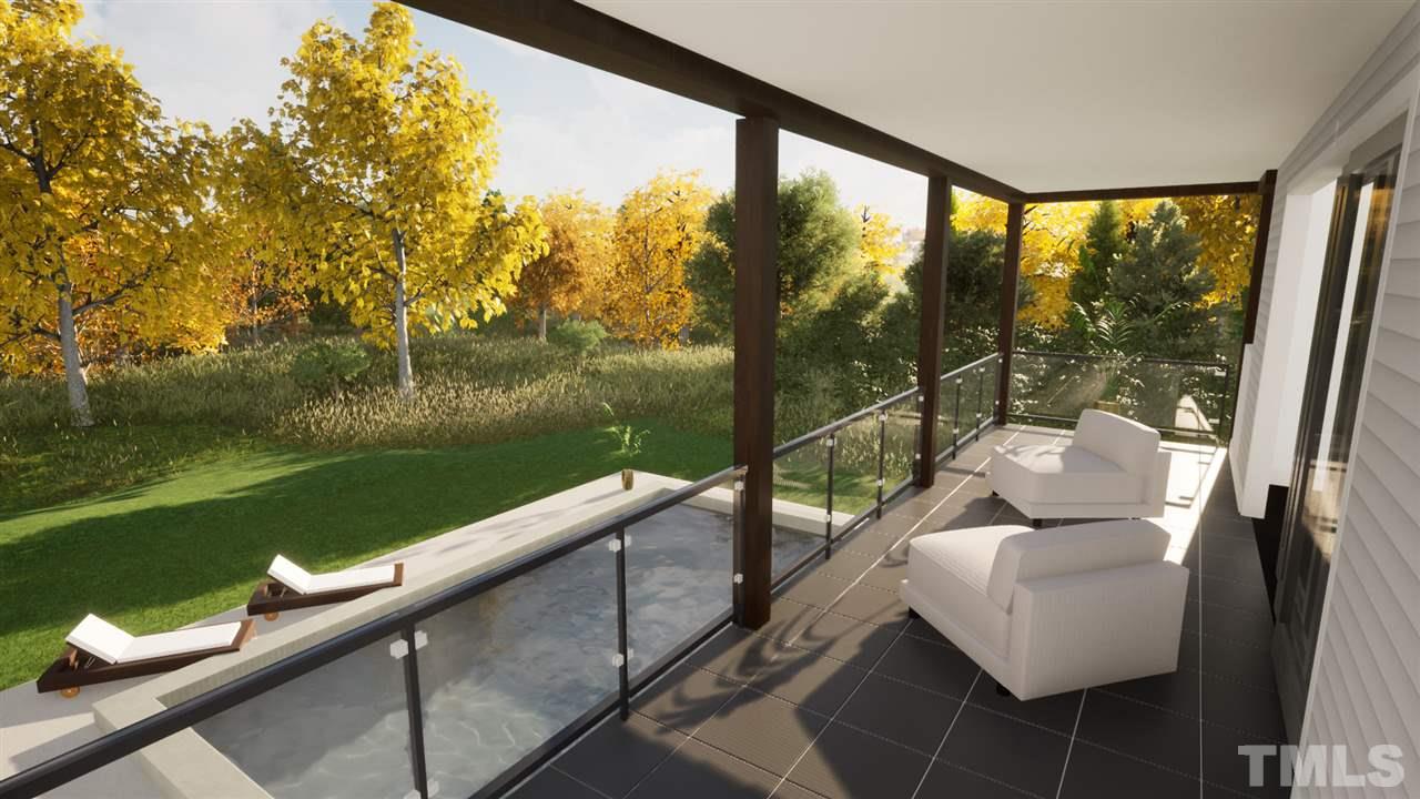 1616 Hunting Ridge Road Raleigh, NC 27615 - Photo 21 of 22 a view of a balcony with lake view and a floor to ceiling window