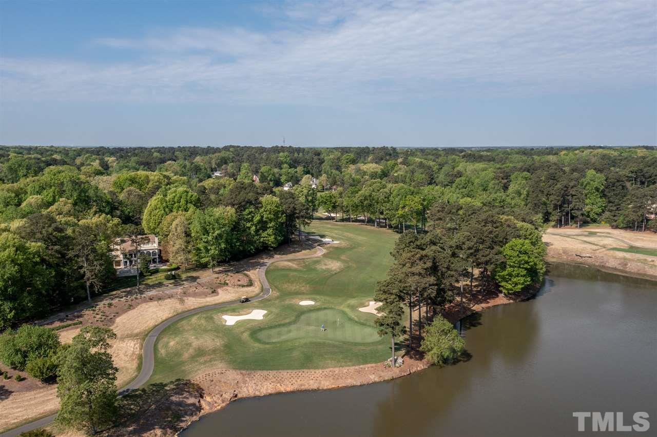 1616 Hunting Ridge Road Raleigh, NC 27615 - Photo 22 of 22 a view of a lake with green space