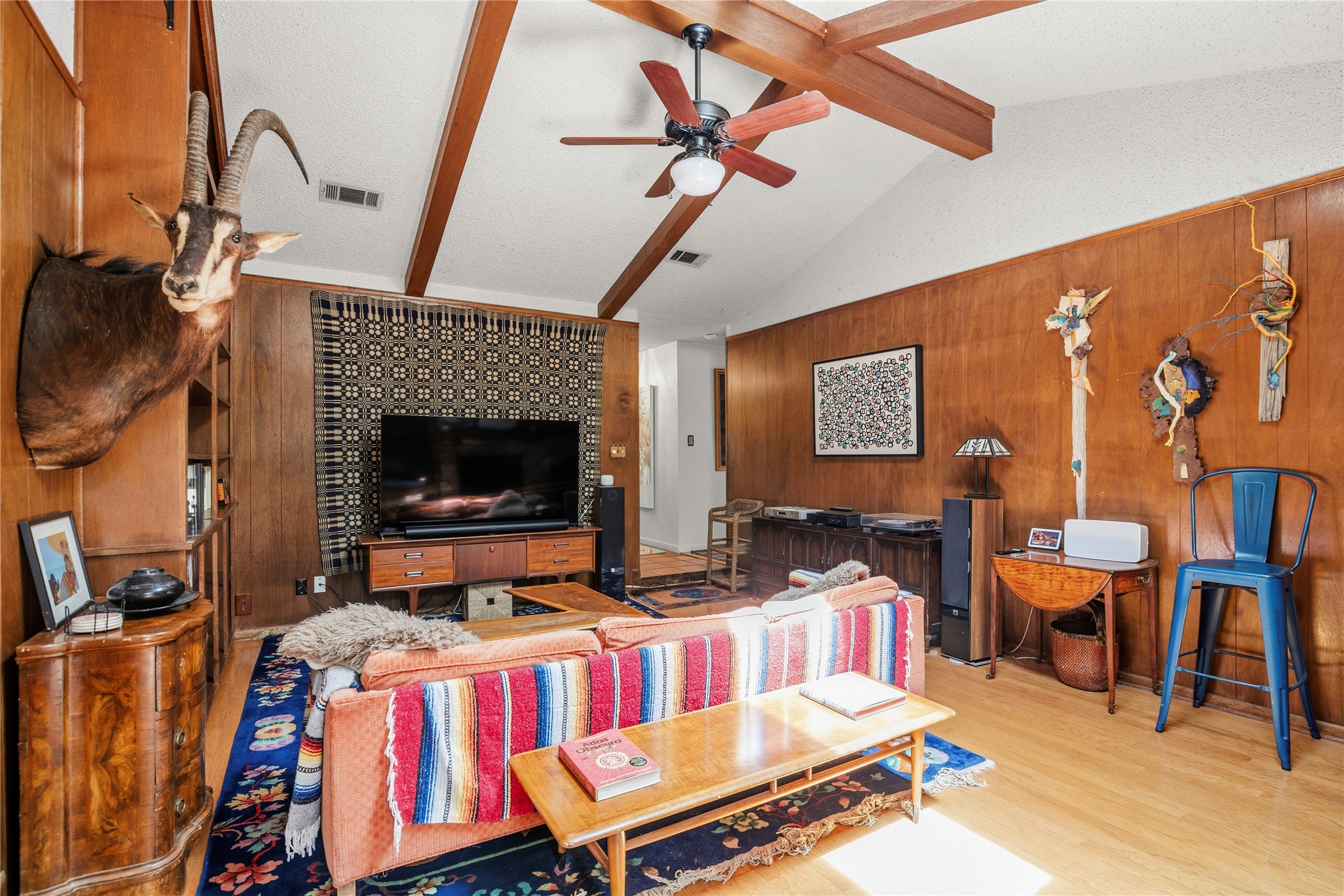 5403 Jeffburn Cove Austin, TX 78745 - Photo 12 of 40 a living room with furniture a flat screen tv and a fireplace