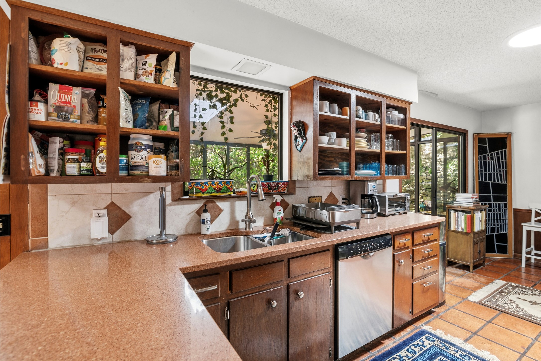 5403 Jeffburn Cove Austin, TX 78745 - Photo 15 of 40 a kitchen with a sink and a stove top oven