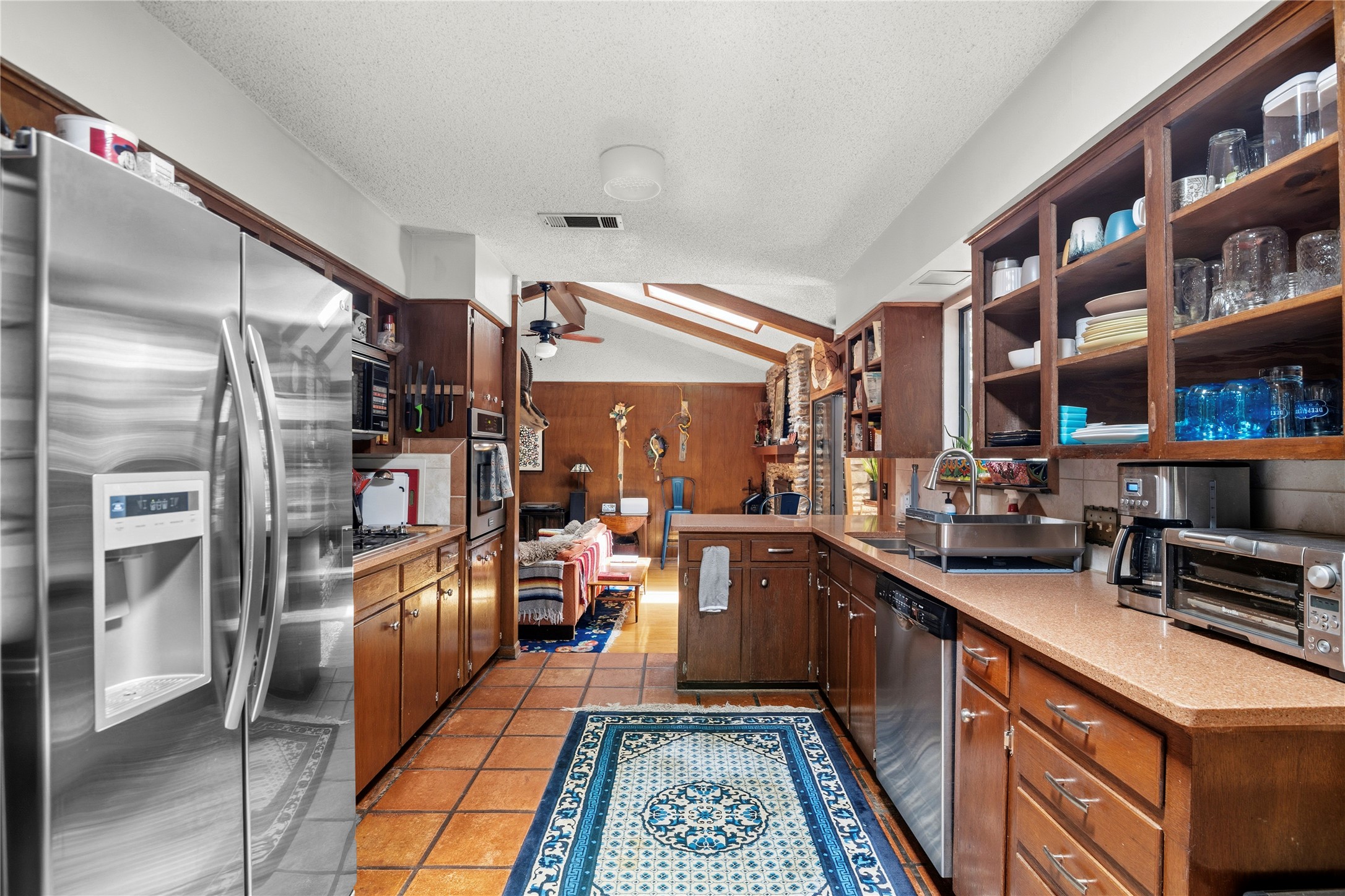 5403 Jeffburn Cove Austin, TX 78745 - Photo 16 of 40 a kitchen with stainless steel appliances granite countertop a refrigerator and a stove