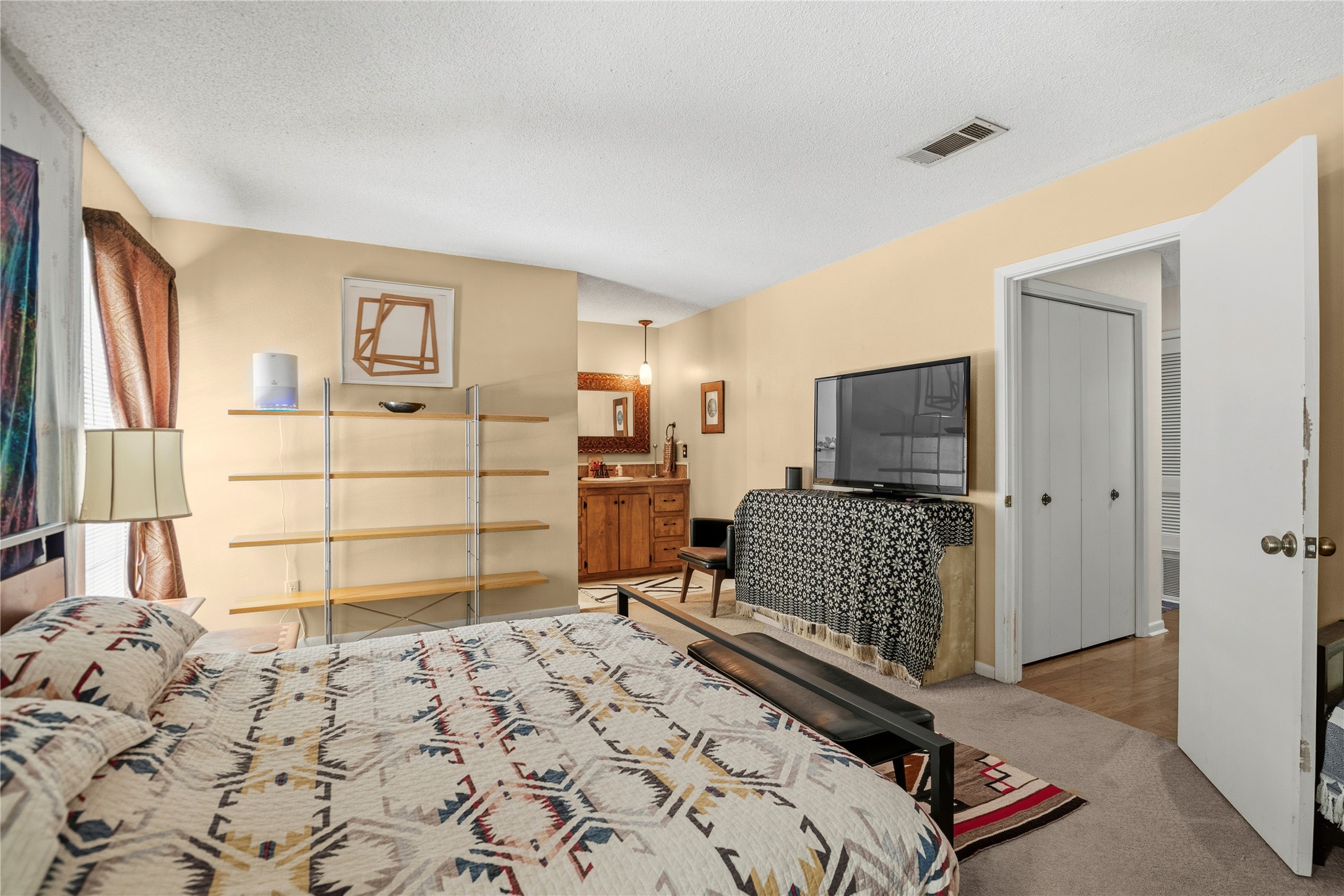 5403 Jeffburn Cove Austin, TX 78745 - Photo 24 of 40 a bedroom with a bed and flat screen tv