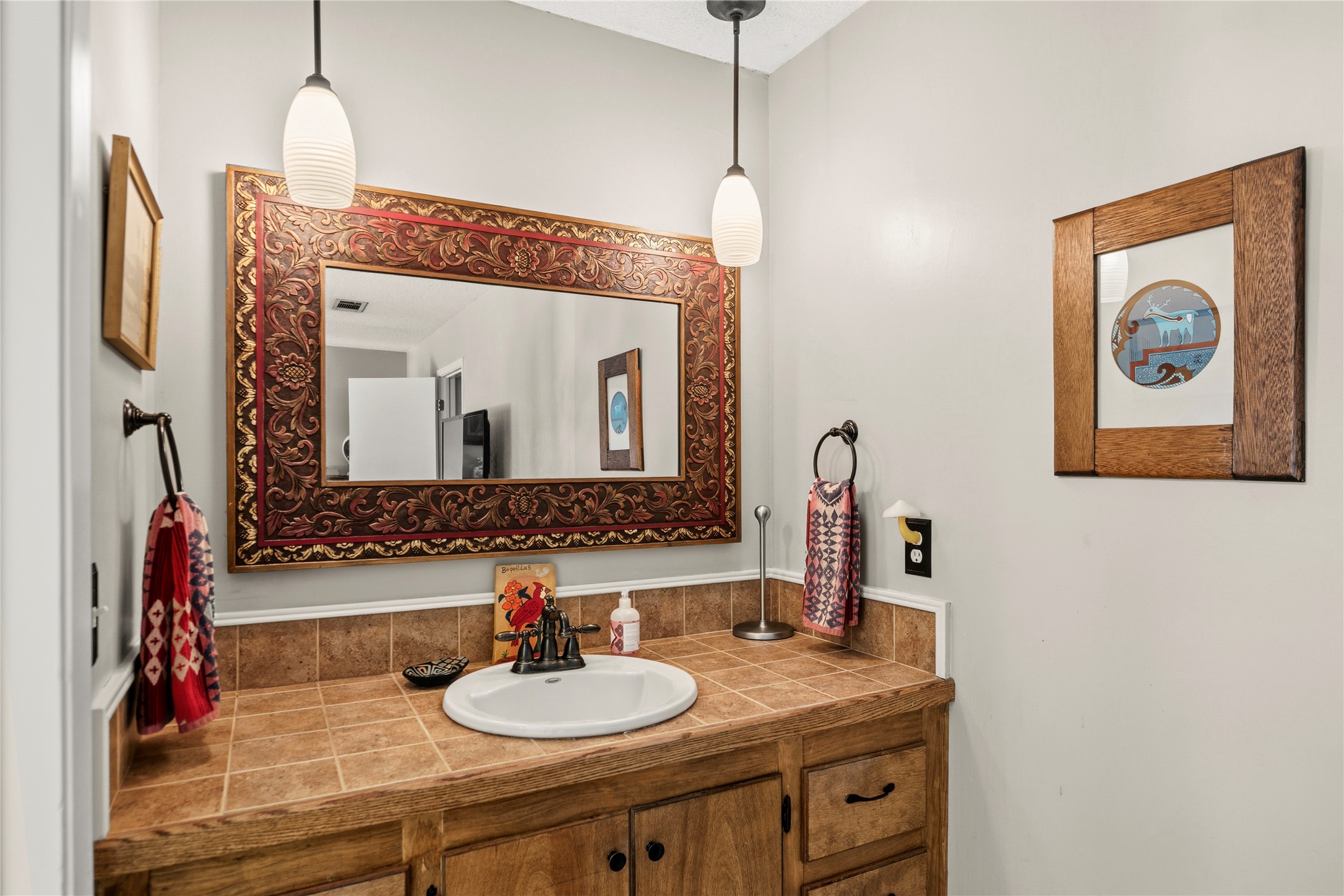 5403 Jeffburn Cove Austin, TX 78745 - Photo 25 of 40 a bathroom with a sink and a mirror