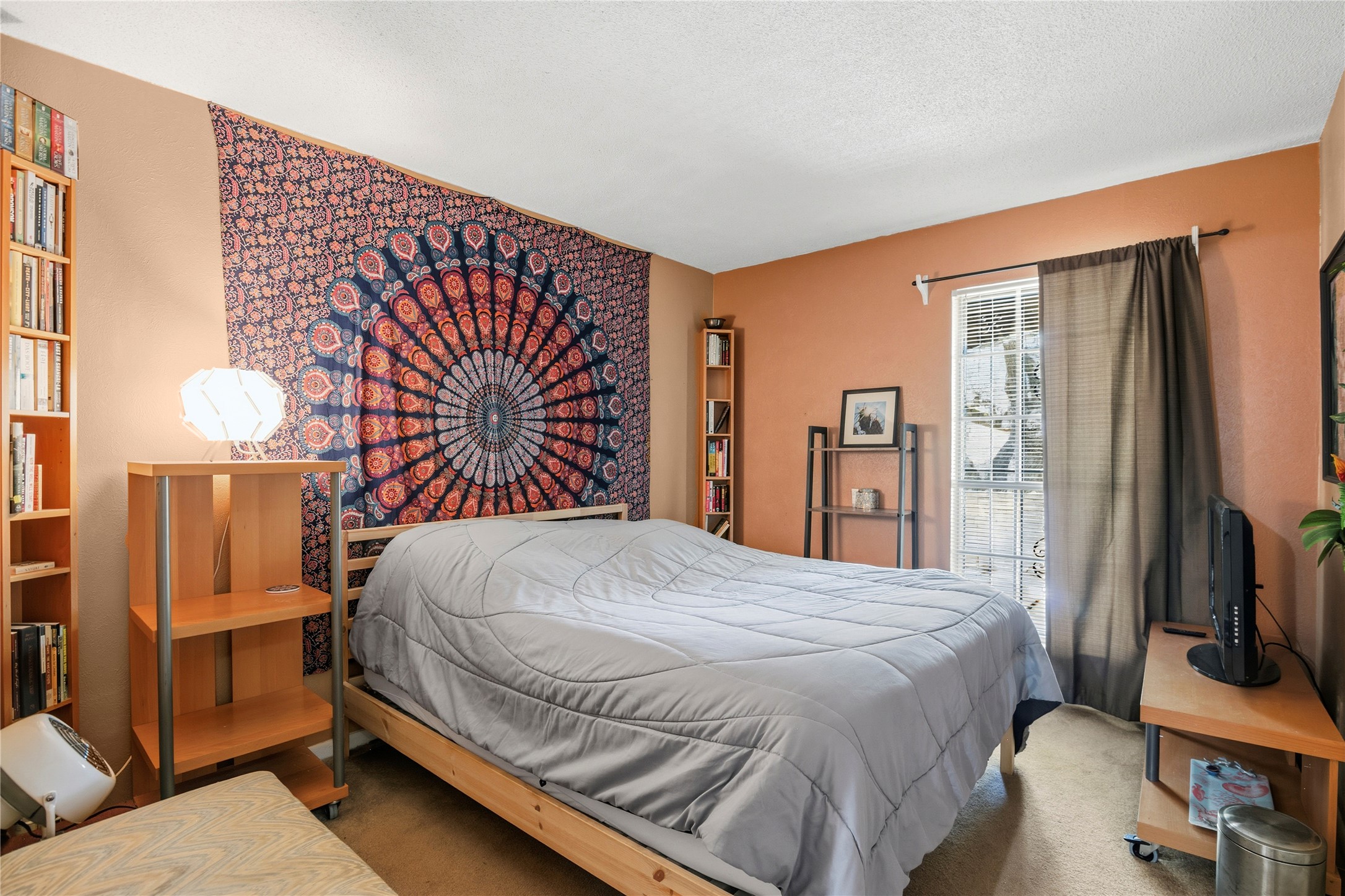 5403 Jeffburn Cove Austin, TX 78745 - Photo 29 of 40 a bedroom with a bed and a flat screen tv
