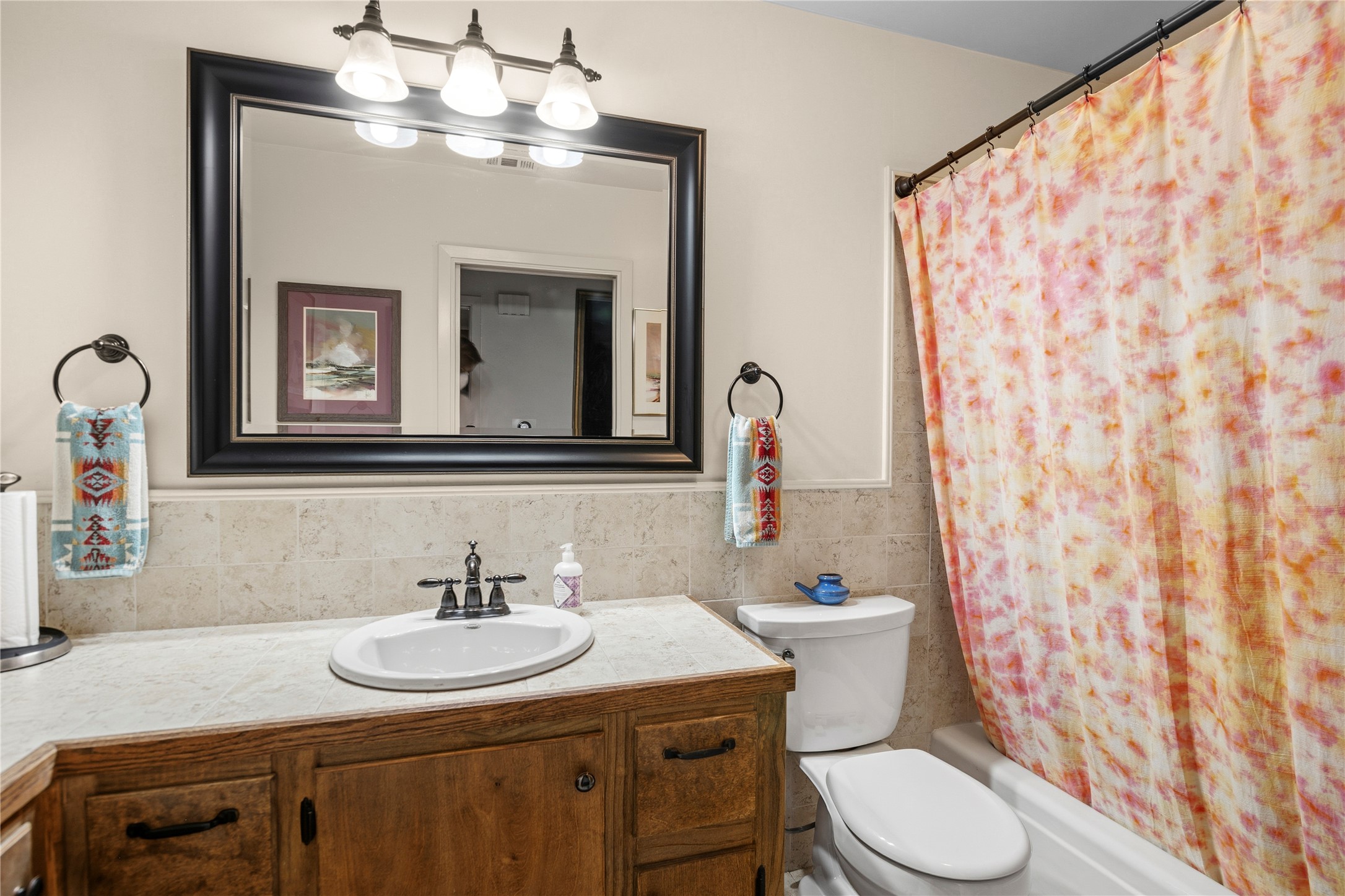 5403 Jeffburn Cove Austin, TX 78745 - Photo 31 of 40 a bathroom with a sink toilet and mirror