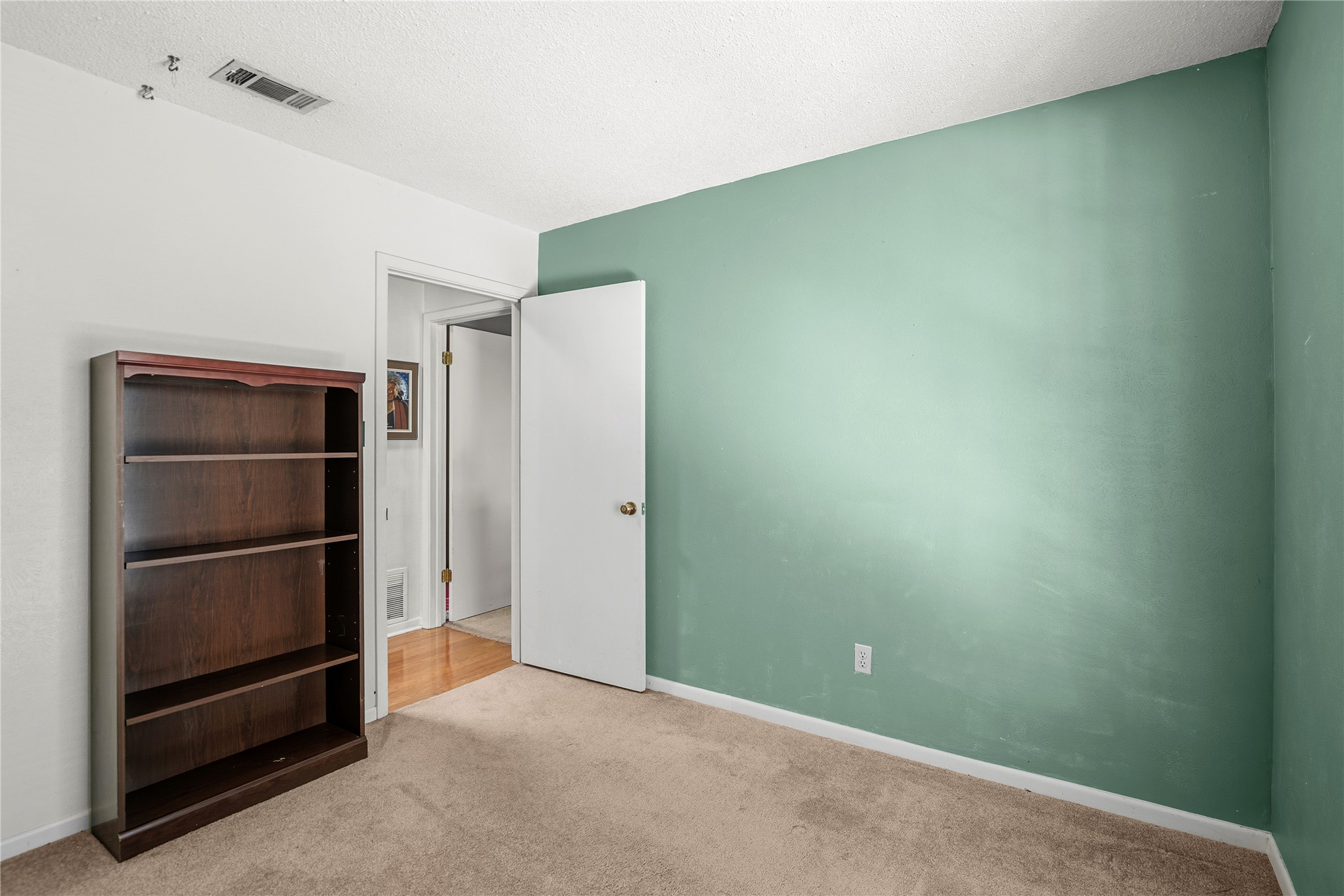 5403 Jeffburn Cove Austin, TX 78745 - Photo 35 of 40 a view of an empty room with empty shelves