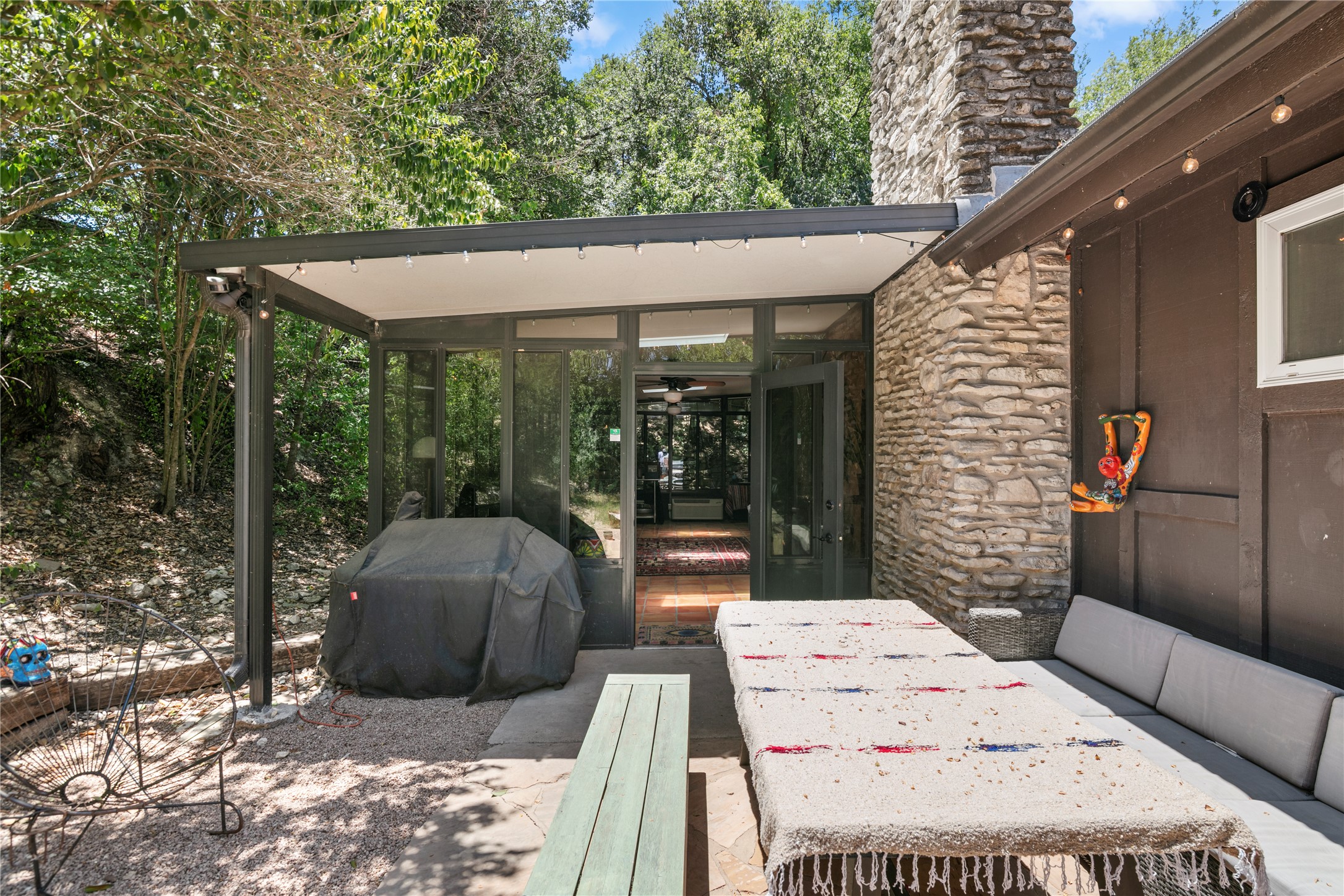 5403 Jeffburn Cove Austin, TX 78745 - Photo 39 of 40 a view of a patio with table and chairs potted plants with wooden floor