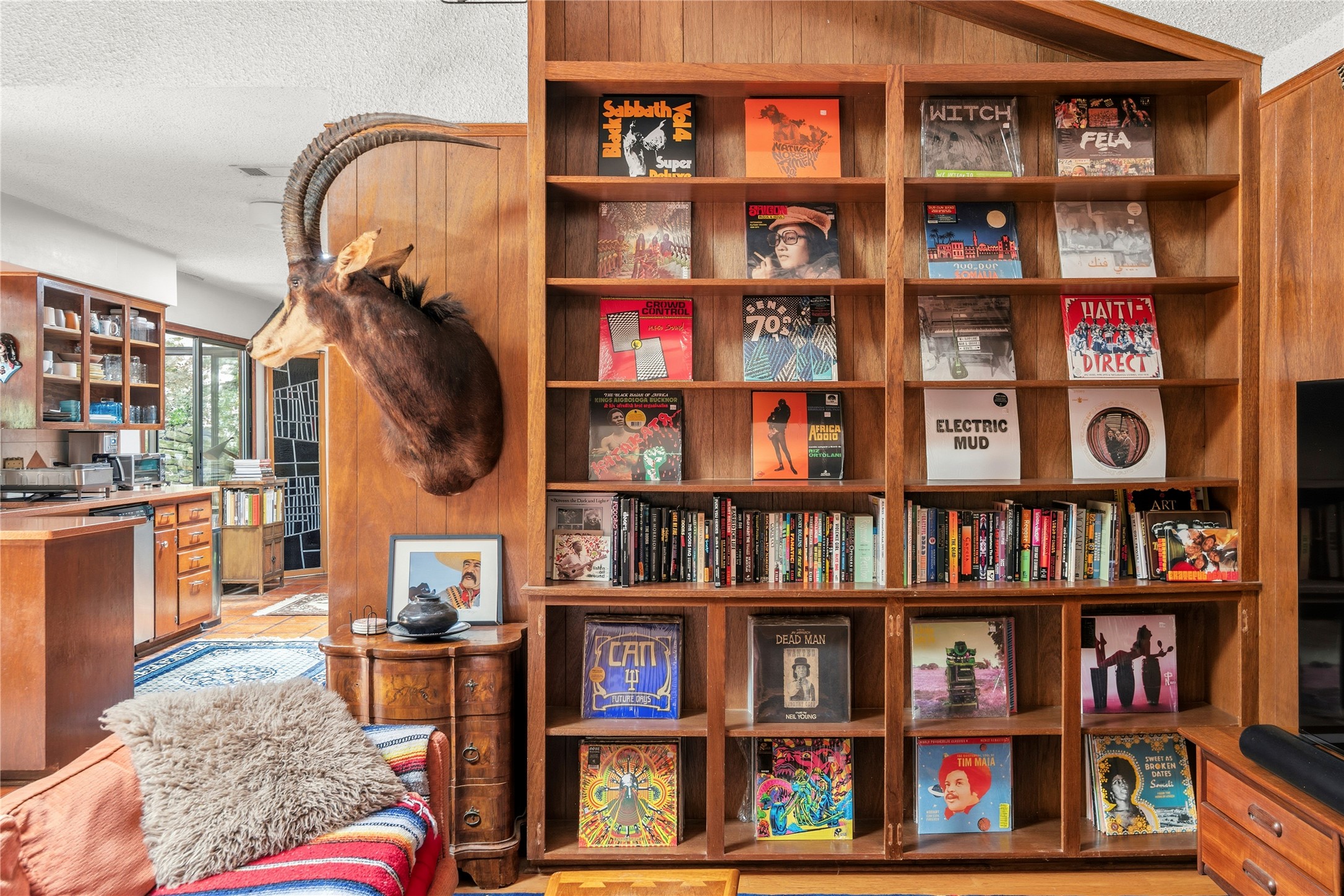 5403 Jeffburn Cove Austin, TX 78745 - Photo 6 of 40 a living room with bookshelf and a book shelf