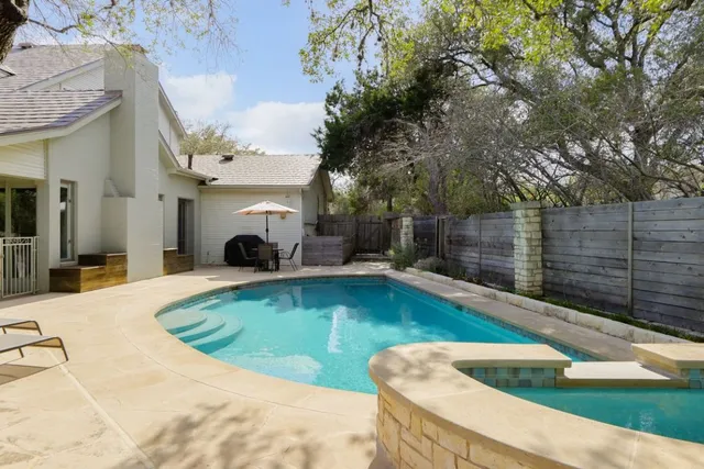 a view of swimming pool with seating space
