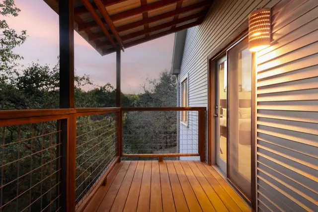 a view of balcony with wooden floor