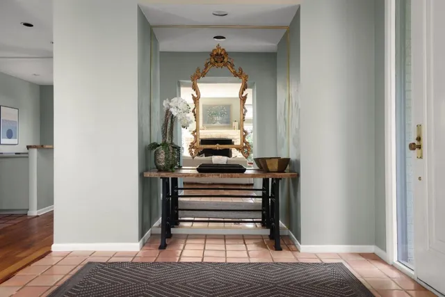 a bedroom with a bed and a mirror