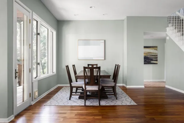 a view of a dining room with furniture window and wooden floor