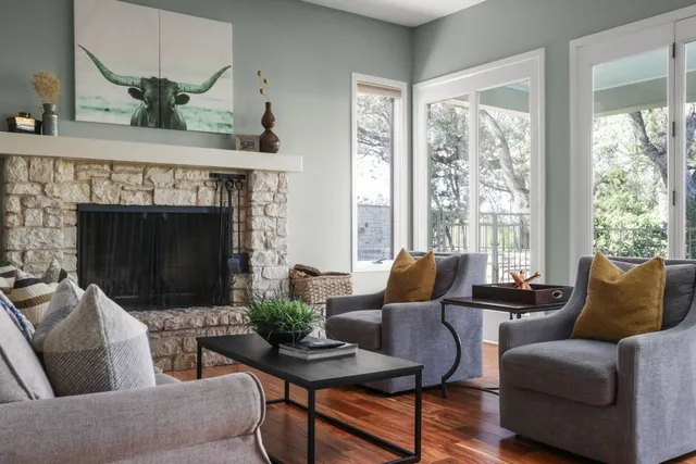 a living room with furniture and a fireplace