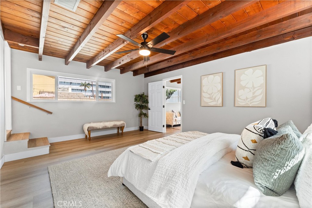 8039 4th Street Downey, CA 90241 - Photo 11 of 26 a bedroom with furniture and a large window